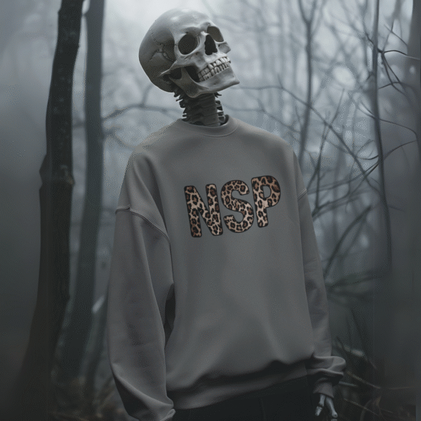 Heather gray sweatshirt with bold leopard print accents and the Night Shift Paranormal logo on the chest, displayed flat on a neutral background.